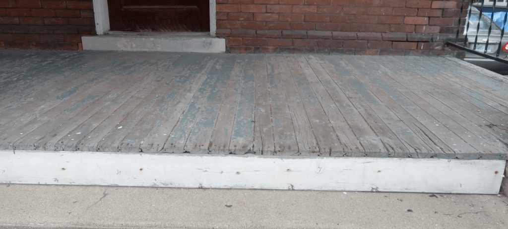 Front porch deck refinished — before